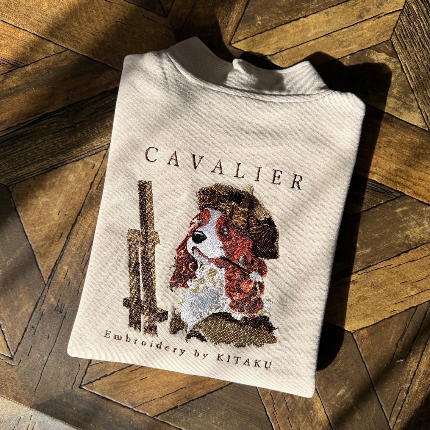 キャバリア画伯のハーフジップ